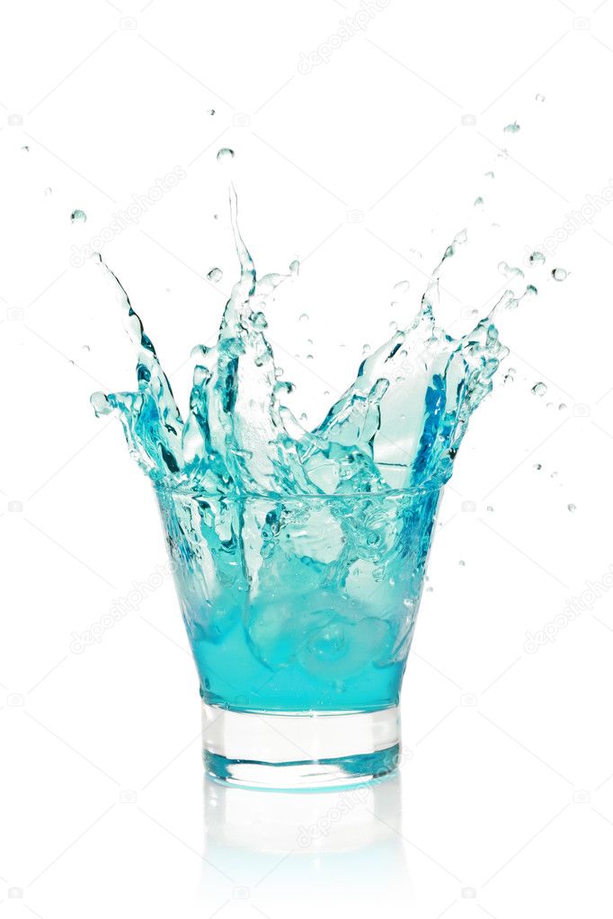 Glass with splashing blue drink