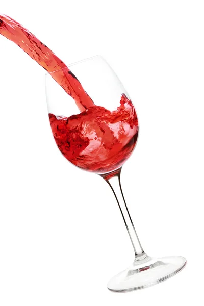 Salpicadura de vino tinto en la copa — Foto de Stock