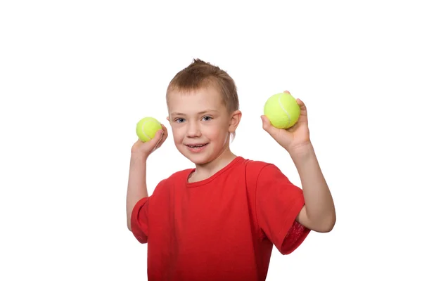 Niño con pelotas de tenis — Foto de Stock