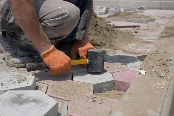 Worker paving stones — Stock Image Worker paving stones Royalty Free Stock Photos