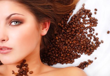 Woman's face with coffee beans clipart