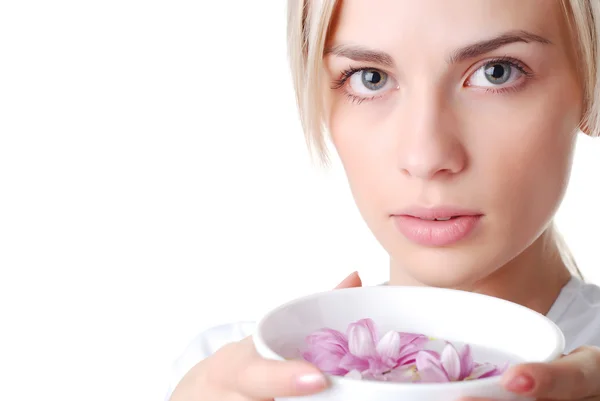 Woman and bowl of flowers — Stock Photo, Image
