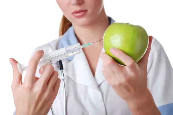 Nurse with syringe and apple — Stock Photo, Image