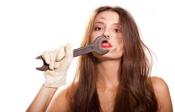 Woman and wrench — Stock Photo, Image