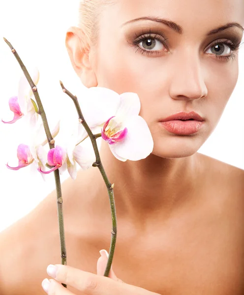 Woman and orchid Stock Picture