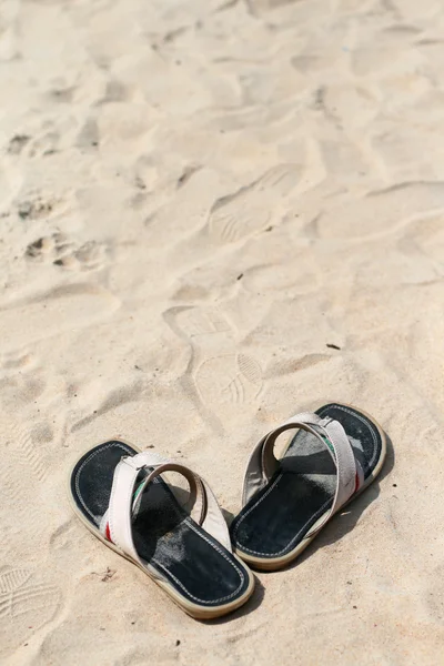 Sandals and sand — Stok fotoğraf