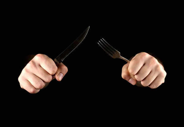 Mains avec couteau et fourchette — Photo