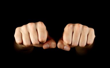 Two fists isolated on black background clipart