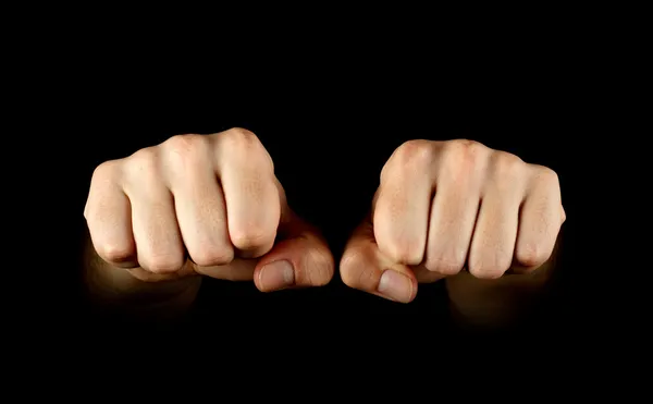 Two fists isolated on black background — Stock Photo, Image