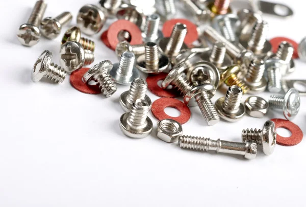 Screws, bolts and nuts on a white background — Stock Photo, Image