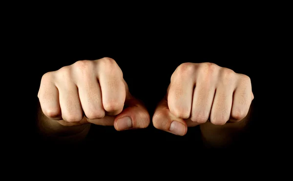 Two fists isolated on black background Stock Picture