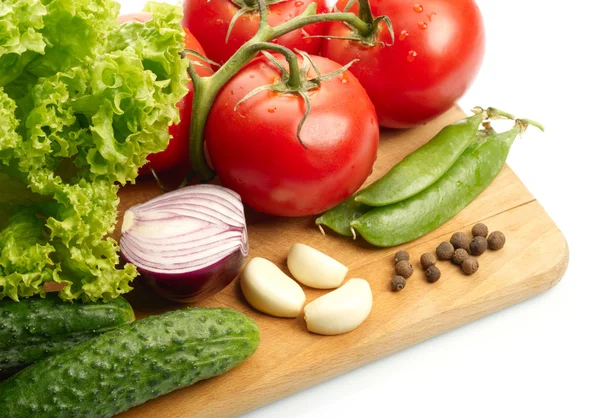 Fresh vegetables on wooden hardboard — Stock Photo, Image