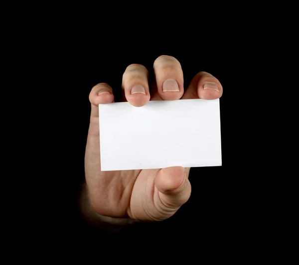 Χέρι με μαύρο επαγγελματική κάρτα σε μαύρο φόντο — Φωτογραφία Αρχείου