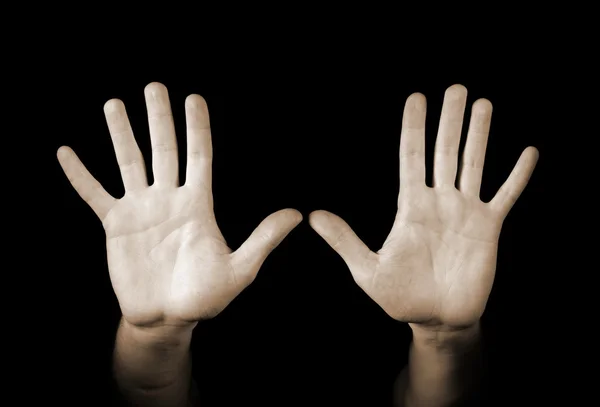 Hände isoliert auf schwarzem Hintergrund — Stockfoto