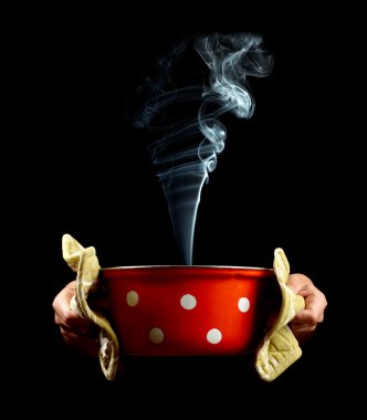 Pan with smoke in hands clipart