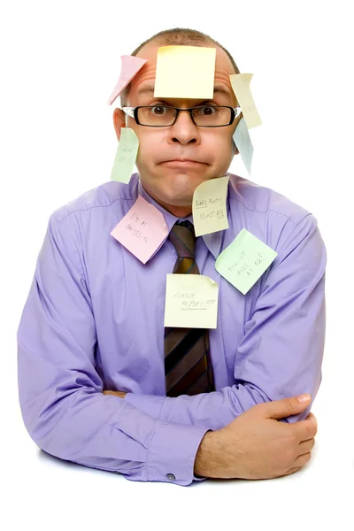 Hombre de negocios cubierto de notas adhesivas — Foto de Stock
