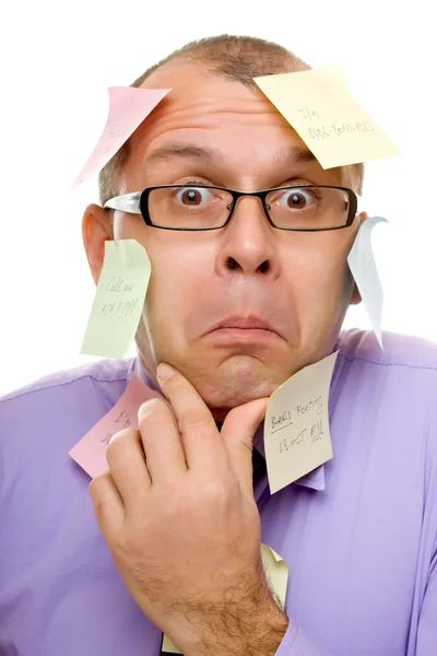 Homem de negócios coberto com notas pegajosas — Fotografia de Stock