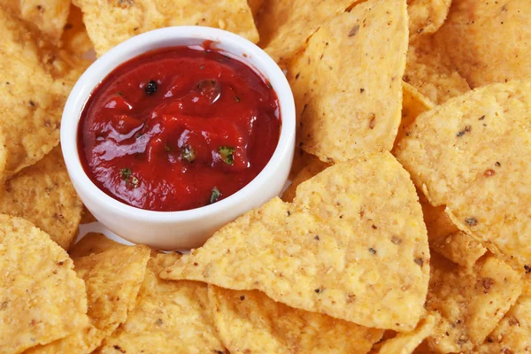 Tortilla chips with hot salsa dip — Stock Photo, Image
