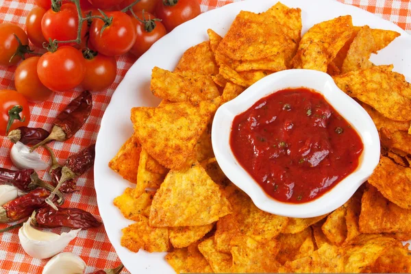 Tortilla chips with hot salsa dip — Stock Photo, Image