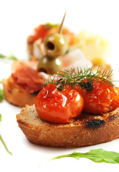 Bruschette with tomato and olives — Stock Photo, Image