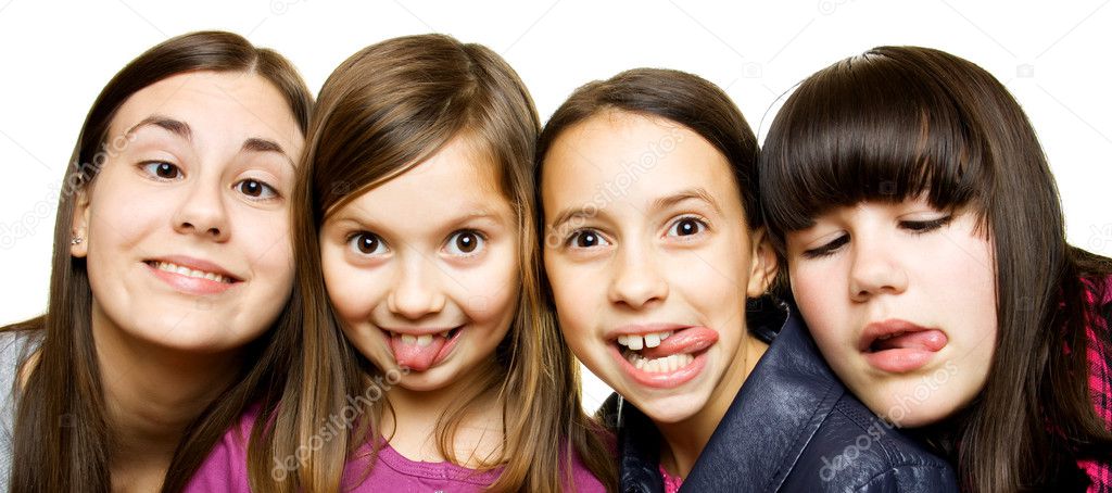 Four young girls making funny faces