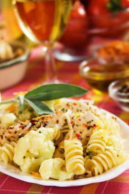 Pasta with cauliflower and chicken meat clipart