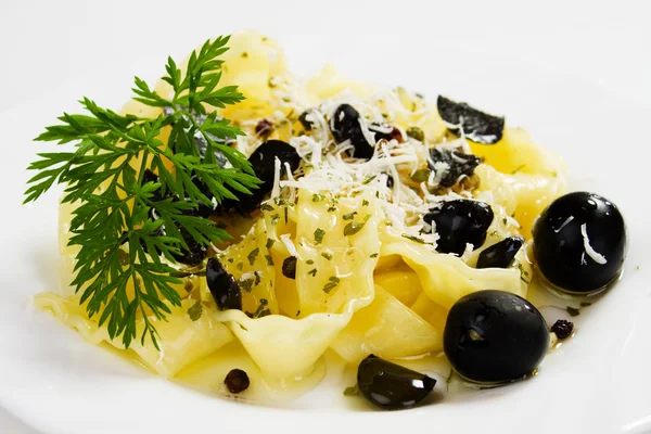 Italian pasta with black olives — Stock Photo, Image