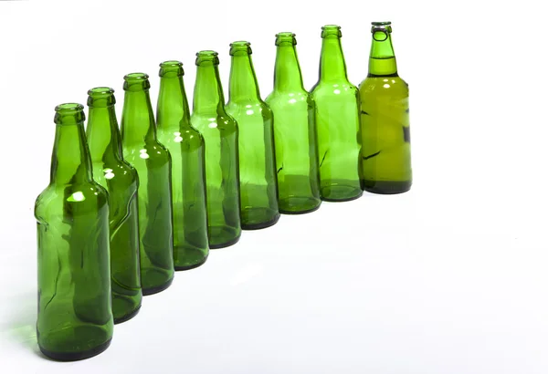 Botellas de vidrio vacías y una llena —  Fotos de Stock