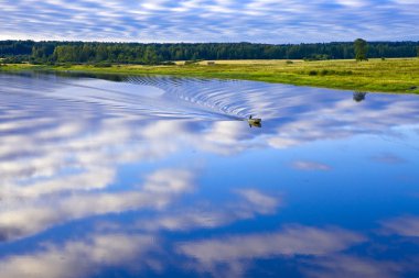 Evening above river. Tigoda. Russia. clipart