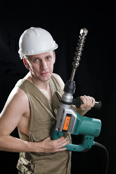 O construtor em um capacete protetor — Fotografia de Stock