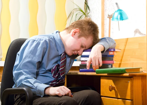 Schoolboy fell asleep, being tired of doing lessons — Stock Photo, Image