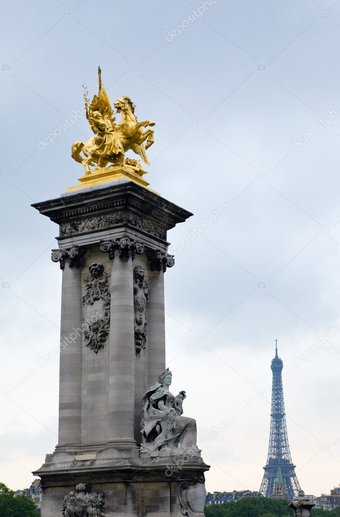 Sculptural group on The Alexander III Bridge across Seine river in Paris, F