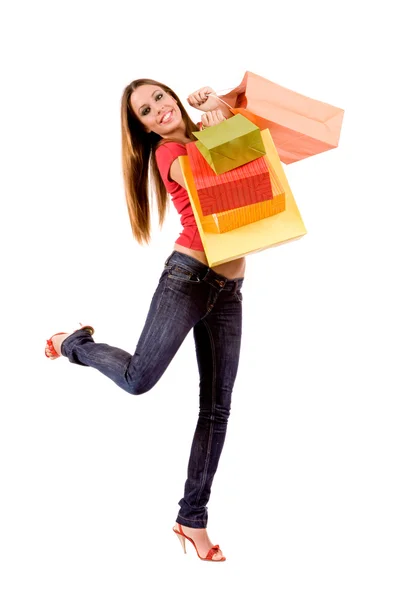 Menina de compras bonita com sacos coloridos — Fotografia de Stock