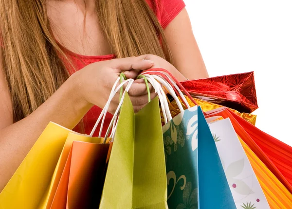 Mãos femininas segurar saco de compras colorido — Fotografia de Stock