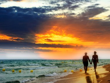 Lovers at the beach clipart