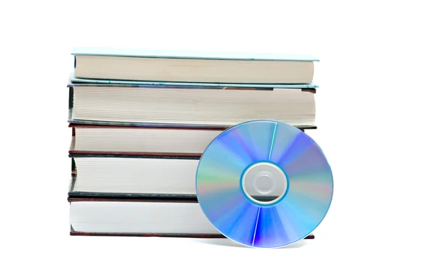 Pile of books and DVD disk as symbols of old and — Stock Photo, Image