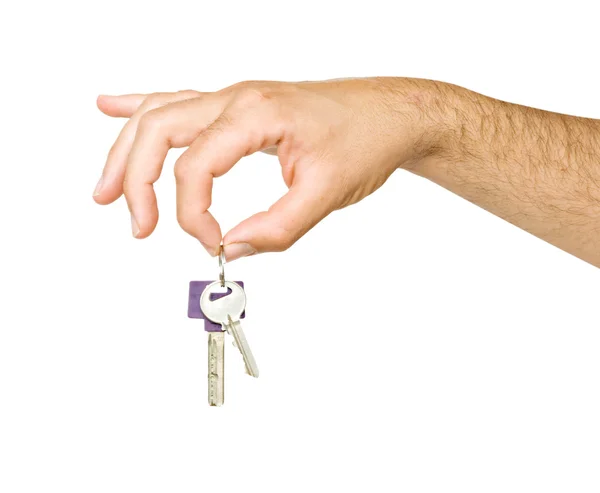 Close up of hand holding keys isolated on backgr — Stock Photo, Image