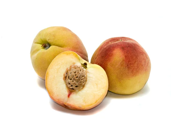 Персики и секции — стоковое фото