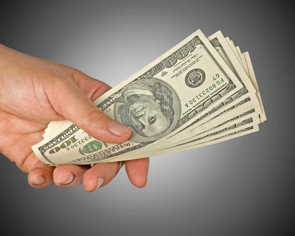 Mão com notas de dólar isoladas no fundo — Fotografia de Stock