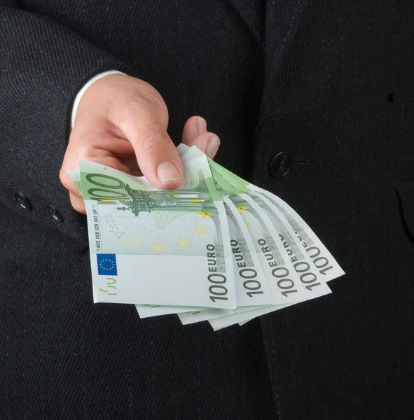 Hand met eurobankbiljetten — Stockfoto
