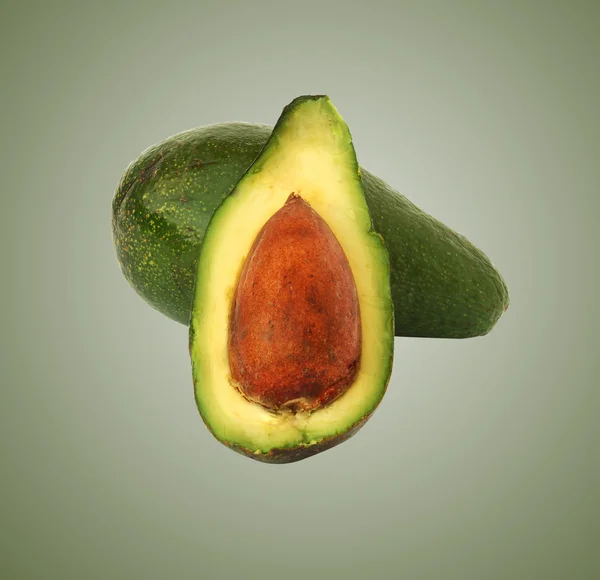 Avocado and its section — Stock Photo, Image