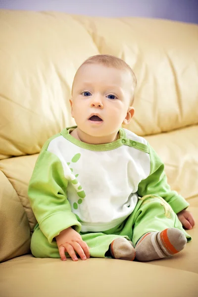 Beautiful baby on sofa — Stock Photo, Image