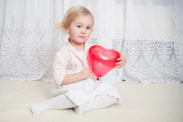 Girl with heart balloon — Stock Photo, Image