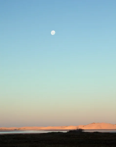 stock image Moon rising over a lagoon