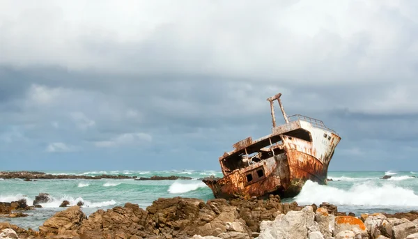 Shipwreck lying on the rocks