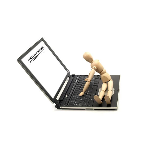 stock image Wood mannequin and laptop