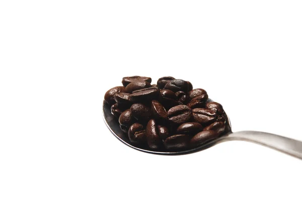 Kávová zrna na lžíci — Stock fotografie