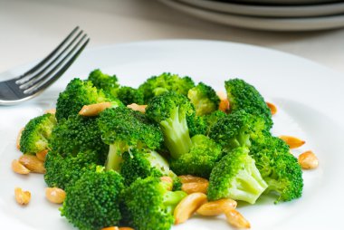 Fresh sauteed broccoli and almonds clipart