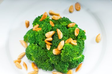 Fresh sauteed broccoli and almonds clipart