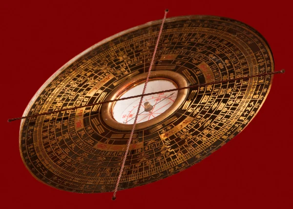stock image Feng shui compass Luopan on red background